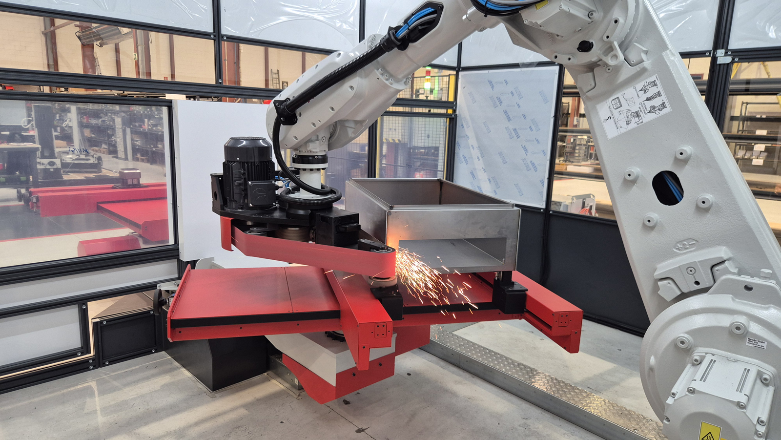 AUTOMATIC REMOVAL OF WELD SEAMS FROM A WIDE VARIETY OF SHEET METAL PARTS