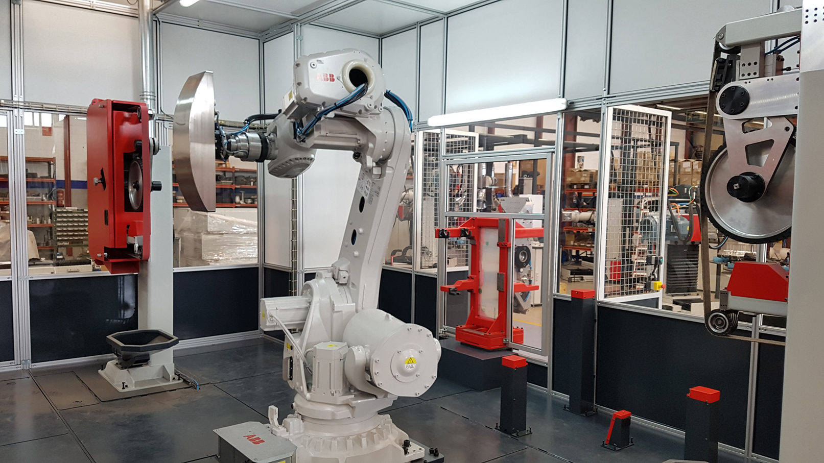 ROBOT CELL FOR THE DEBURRING, GRINDING AND SATIN FINISHING OF STREET FURNITURE (PARKING METER AND OTHERS) & METRO PASSENGER CONTROL PASS