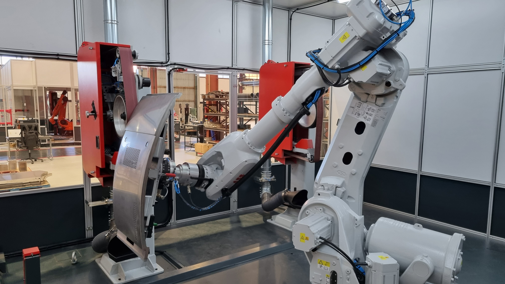 ROBOT CELL FOR THE WELD DRESSING OF FINE METAL WORK - PHARMACEUTICAL EQUIPMENT
